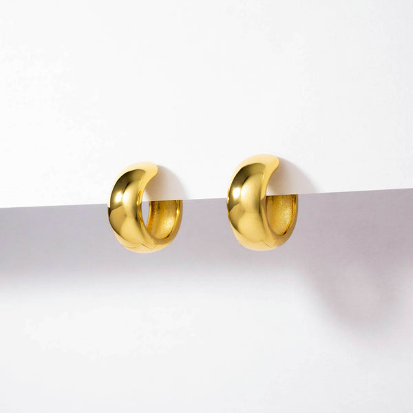 18k gold plated 925 Sterling Silver ‘Bold Small Hoops’ Earrings with Latch closure hanging on white background