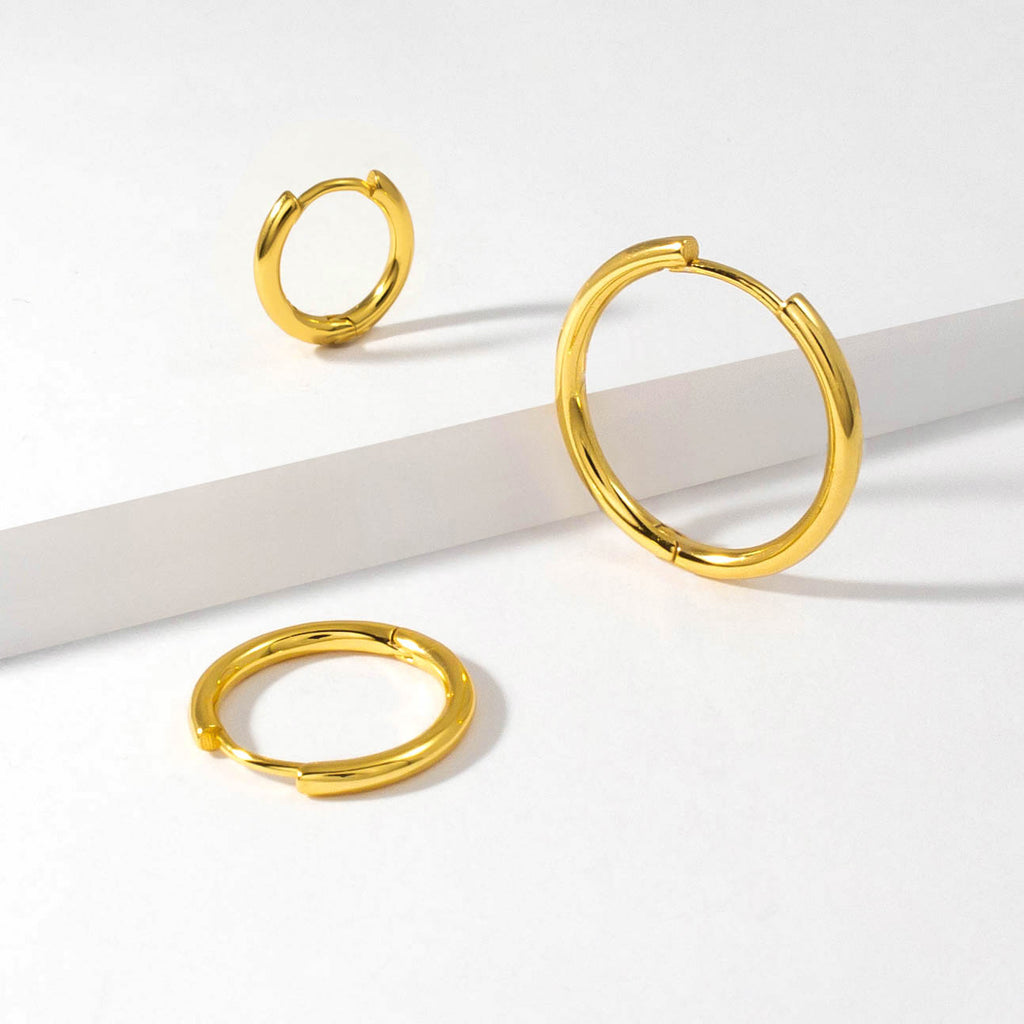 18k gold plated 925 Sterling Silver Three Sizes ‘Classic Hoops’ Earrings with Latch closure laying on white background